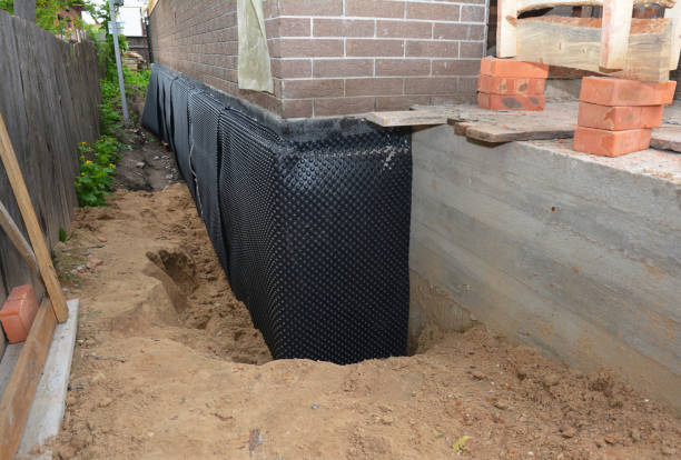 Happy homeowners after waterproofing job in Payne